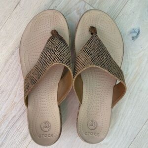 Crocs sandals with 2 in platforms, tan and size 9 wide.